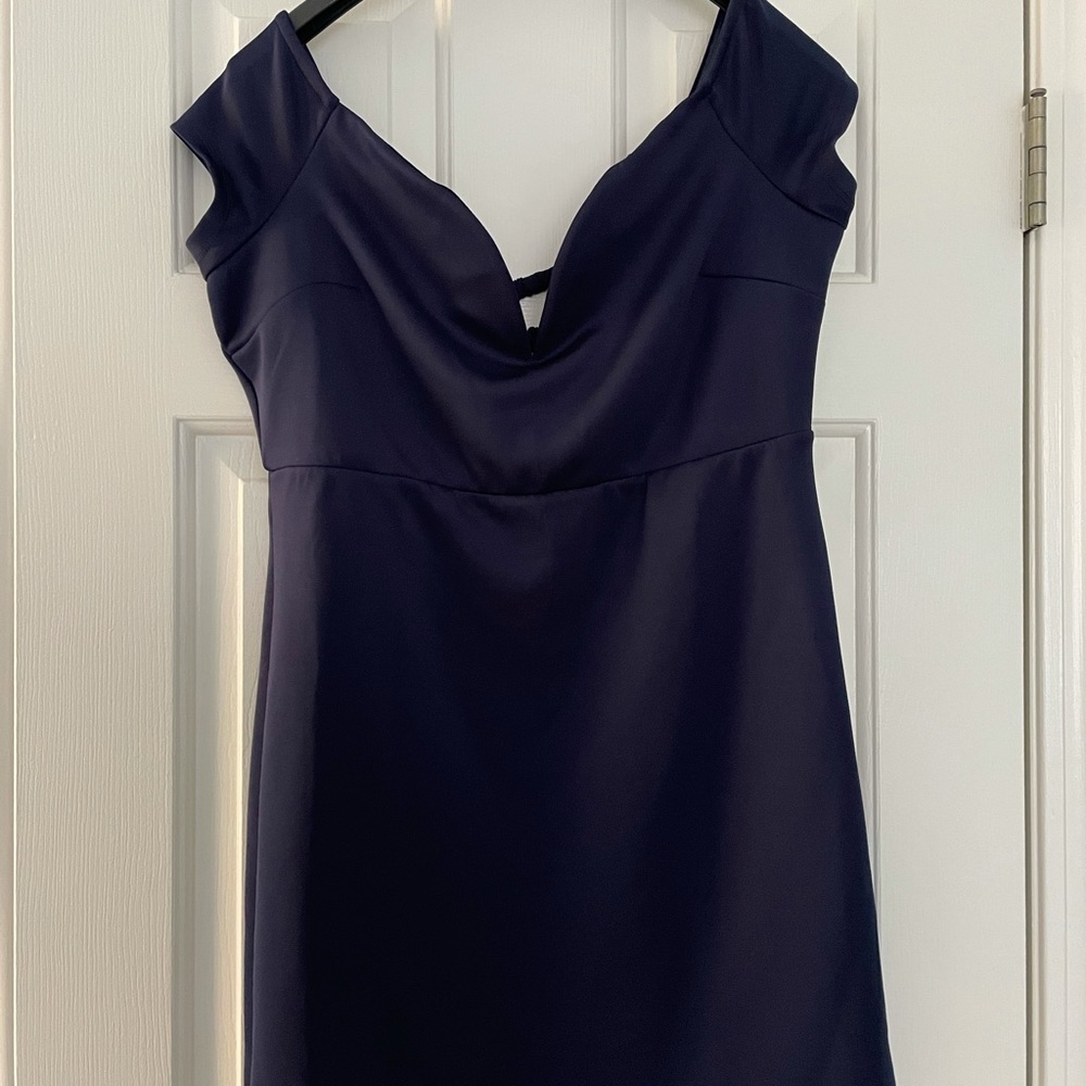Navy dress, capped sleeves. Falls just above knees for you next occasion